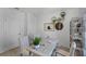 Bright home office with modern desk, striped chairs, and neutral tones at 3711 Bluethread Way, Poinciana, FL 34759