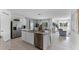 Open kitchen with stainless steel appliances flows into the dining and living areas at 3711 Bluethread Way, Poinciana, FL 34759