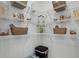 Well-organized walk-in pantry with ample shelving for storage and organization at 3711 Bluethread Way, Poinciana, FL 34759