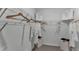 Organized walk-in closet with shelving, hanging rods, and convenient storage bins for accessories at 3711 Bluethread Way, Poinciana, FL 34759