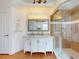 Bathroom featuring a vanity with marble countertop, framed mirror and frameless glass walk-in shower at 3728 Hunters Isle Dr, Orlando, FL 32837
