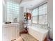 Well-appointed bathroom with soaker tub and modern fixtures at 3728 Hunters Isle Dr, Orlando, FL 32837