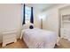 Light-filled bedroom with a window, matching nightstand, and decor to make it feel like home at 3728 Hunters Isle Dr, Orlando, FL 32837