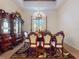 Ornate dining room featuring a decorative chandelier, elegant furnishings, and a traditional ambiance at 3728 Hunters Isle Dr, Orlando, FL 32837