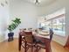 Inviting dining area overlooking a serene pool and lake view, perfect for entertaining at 3728 Hunters Isle Dr, Orlando, FL 32837