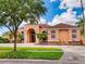 Charming home exterior featuring well-maintained landscaping, creating an inviting curb appeal at 3728 Hunters Isle Dr, Orlando, FL 32837