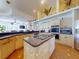 Spacious kitchen with an island cooktop, ample counter space, and stainless steel appliances at 3728 Hunters Isle Dr, Orlando, FL 32837