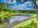 Scenic lake view with lush landscaping, creating a peaceful and picturesque setting at 3728 Hunters Isle Dr, Orlando, FL 32837