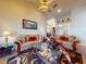 Inviting living room boasting high ceilings, plush seating, and decorative accents at 3728 Hunters Isle Dr, Orlando, FL 32837