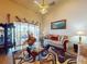 Comfortable living room with waterfront views, cozy sofas, and a decorative rug, perfect for relaxation at 3728 Hunters Isle Dr, Orlando, FL 32837