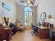 Dedicated office space is complete with tiled floor, ceiling fan, and natural light at 3728 Hunters Isle Dr, Orlando, FL 32837