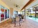 Outdoor patio with seating, a ceiling fan, a pool and a beautiful water view at 3728 Hunters Isle Dr, Orlando, FL 32837