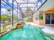 Scenic screened pool with rock waterfall and waterfront views, ideal for relaxation and outdoor entertainment at 3728 Hunters Isle Dr, Orlando, FL 32837