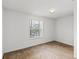 Bright bedroom with plush carpeting and a sunny window at 404 Bar Ct, Kissimmee, FL 34759