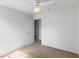 Clean, neutral bedroom has ceiling fan and natural light at 404 Bar Ct, Kissimmee, FL 34759