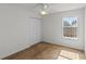 Clean bedroom with a ceiling fan and a closet for optimal storage at 404 Bar Ct, Kissimmee, FL 34759
