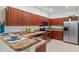 Bright kitchen showcases wooden cabinets, stainless steel appliances, and ample counter space at 404 Bar Ct, Kissimmee, FL 34759