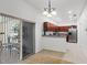 Modern kitchen with wood cabinets, granite counters, stainless steel appliances, and ample counter space at 404 Bar Ct, Kissimmee, FL 34759