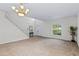 Expansive living room features neutral walls, recessed lighting and staircase leading upstairs at 404 Bar Ct, Kissimmee, FL 34759