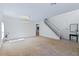 Spacious living room features neutral walls, recessed lighting and staircase leading upstairs at 404 Bar Ct, Kissimmee, FL 34759