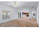 Spacious living room offers a ceiling fan, neutral walls, and a doorway leading to the kitchen at 404 Bar Ct, Kissimmee, FL 34759