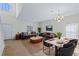 Bright living room features neutral walls, recessed lighting and a dining area with an elegant light fixture at 404 Bar Ct, Kissimmee, FL 34759