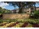 Welcoming Mirasol community sign surrounded by vibrant landscaping and views of the upscale private residences at 506 Mirasol Cir # 202, Celebration, FL 34747