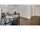 Dining room and living room combination with hardwood floors, sleek modern furniture, and ample light at 506 Mirasol Cir # 202, Celebration, FL 34747
