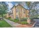 Two-story condo exterior with manicured landscaping and pathway leading to the building at 506 Mirasol Cir # 202, Celebration, FL 34747