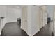 Hallway features dark hardwood floors and provides access to different areas of the home at 506 Mirasol Cir # 202, Celebration, FL 34747