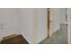 Upstairs hallway with hardwood flooring transitions to carpet and leads to bedrooms and bathrooms at 506 Mirasol Cir # 202, Celebration, FL 34747