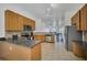 Well-lit kitchen features stainless steel appliances, stone countertops, and open floor plan at 506 Mirasol Cir # 202, Celebration, FL 34747