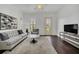 Bright living room with hardwood floors, contemporary furnishings, neutral tones and ceiling fan at 506 Mirasol Cir # 202, Celebration, FL 34747
