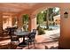 Community patio area showcasing wrought iron table seating underneath an arched veranda at 506 Mirasol Cir # 202, Celebration, FL 34747