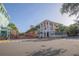 Picturesque street view showcasing colorful buildings, palm trees, and a vibrant community atmosphere at 506 Mirasol Cir # 202, Celebration, FL 34747