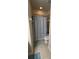 Neutral bathroom with a shower, white toilet, and tile flooring at 5169 Dove Tree, Orlando, FL 32811