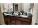 A bathroom vanity showcasing double sinks, dark granite countertops, and ample storage for a stylish yet practical design at 5169 Dove Tree, Orlando, FL 32811
