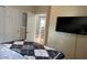 Bedroom with comfortable bed with a tv and open door leading to other rooms at 5169 Dove Tree, Orlando, FL 32811