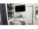 Modern bedroom featuring a workspace with shelves and a large television at 5169 Dove Tree, Orlando, FL 32811