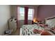 Well-lit bedroom featuring a large window and neutral decor at 5169 Dove Tree, Orlando, FL 32811