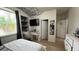 Bright bedroom features a ceiling cloud, desk, and shelving with a view from the window at 5169 Dove Tree, Orlando, FL 32811