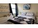 Comfortable bedroom featuring a bed, side table, soft natural light from the window, and calm interior decor at 5169 Dove Tree, Orlando, FL 32811