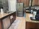 Modern kitchen featuring stainless steel appliances and granite countertops at 5169 Dove Tree, Orlando, FL 32811