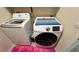 Bright laundry room featuring a washer and dryer set at 5169 Dove Tree, Orlando, FL 32811