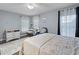 Charming bedroom with plush rug, natural light, and stylish vanity area for relaxation at 6027 Strada Isle Way, Orlando, FL 32835