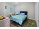 Comfortable bedroom featuring a stylish bed, a cozy chair, and natural light at 6027 Strada Isle Way, Orlando, FL 32835