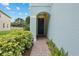 Inviting entryway with landscaped walkway leading to the elegant front door at 6027 Strada Isle Way, Orlando, FL 32835