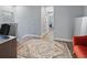 Hallway features hardwood floors leading to the bedrooms and home office area at 6027 Strada Isle Way, Orlando, FL 32835