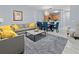Cozy living room with comfortable seating, dining area, and view of the kitchen at 6027 Strada Isle Way, Orlando, FL 32835