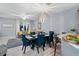 Bright living space with dining area, comfortable seating, and large windows at 6027 Strada Isle Way, Orlando, FL 32835